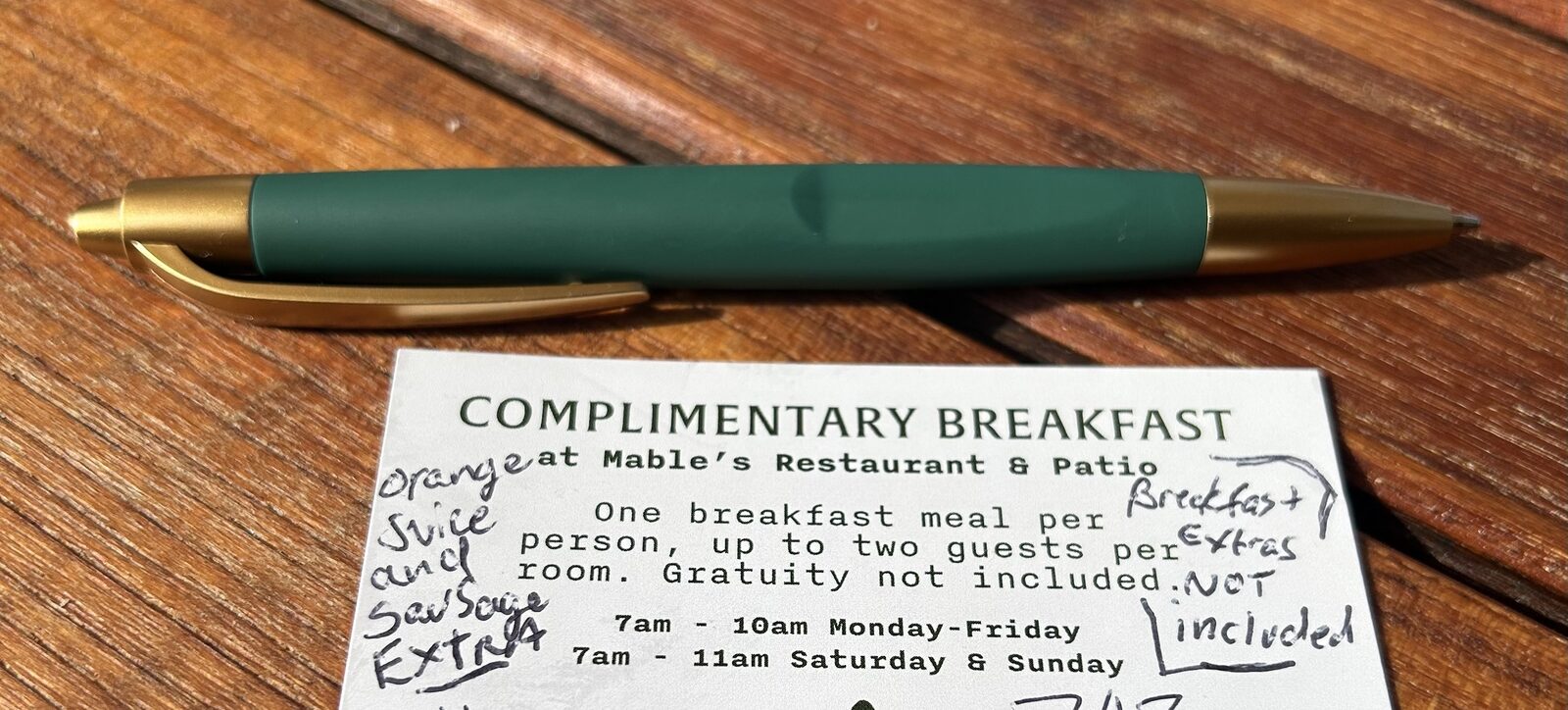 Complimentary breakfast card with handwritten fine print