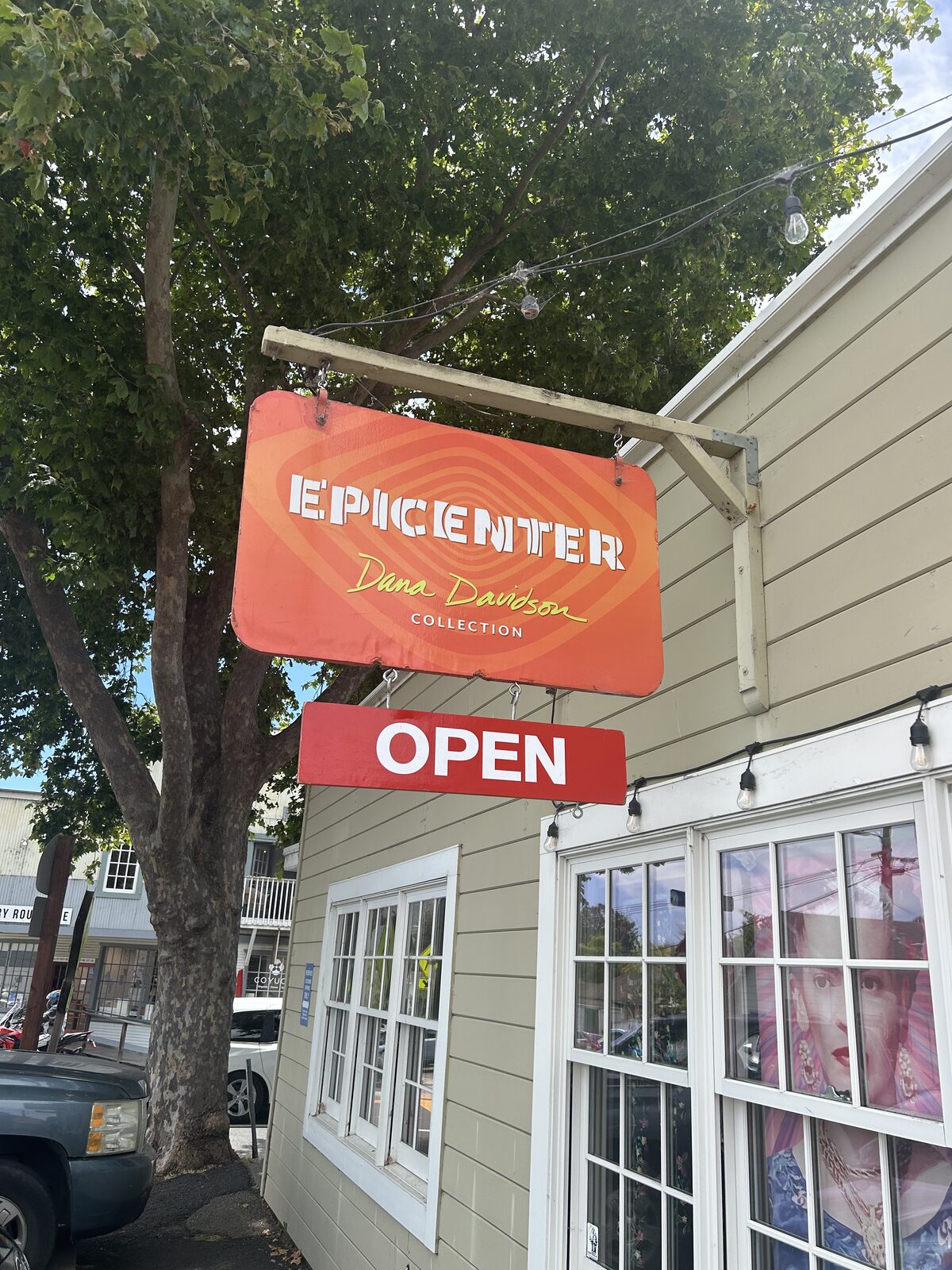 Epicenter shop sign, OPEN lit underneath