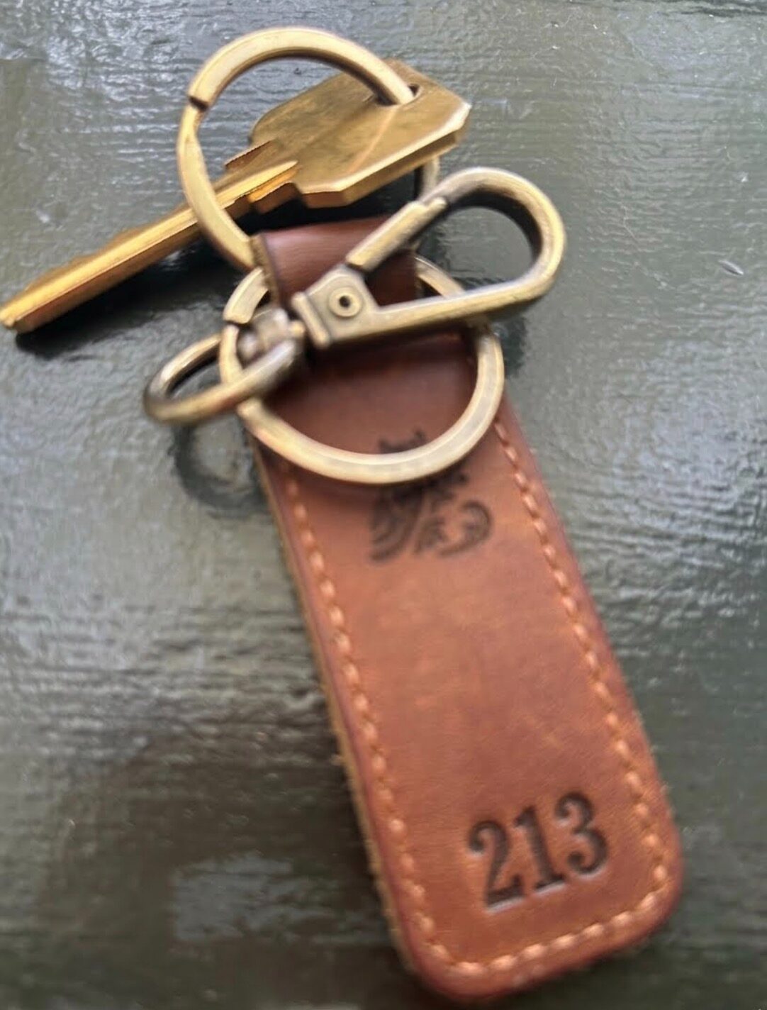 Brass room key on a leather fob