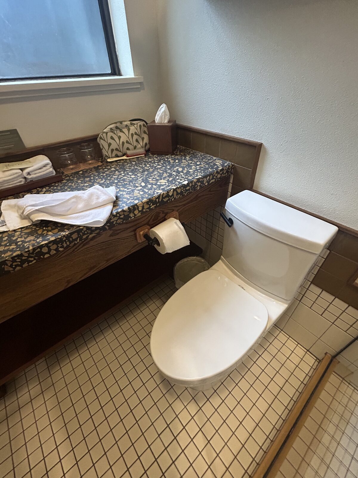 Toilet paper holder mounted close to the toilet