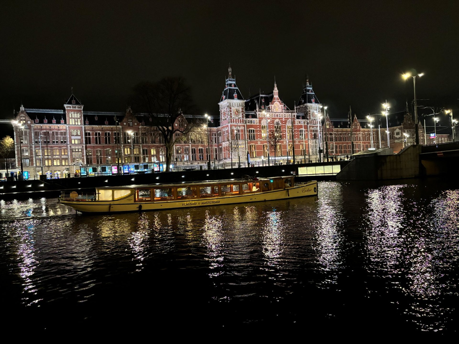 Flagship Amsterdam canal boat at night