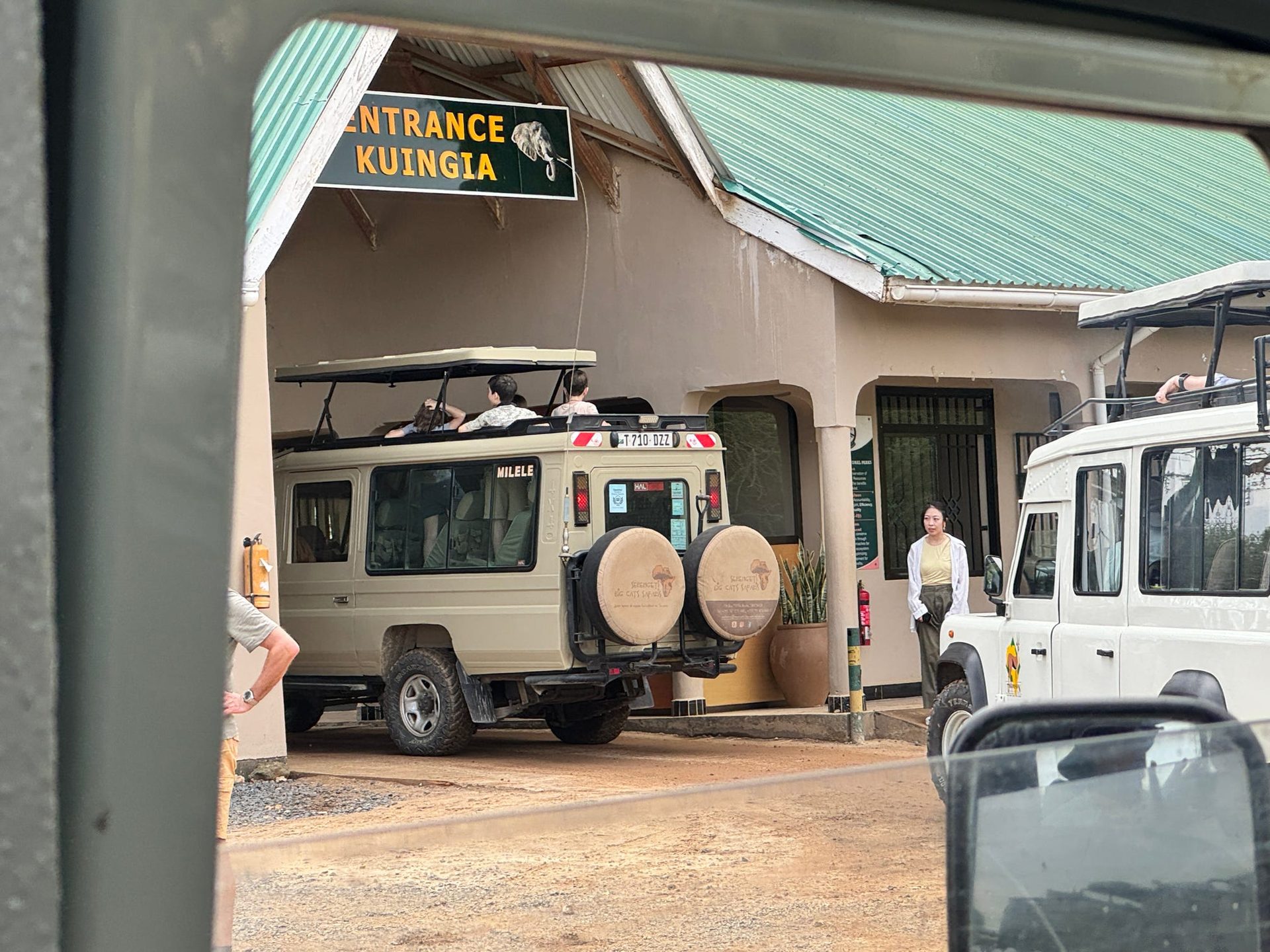 Entrance / Kuingia gate framed through the Land Rover window as we pass through