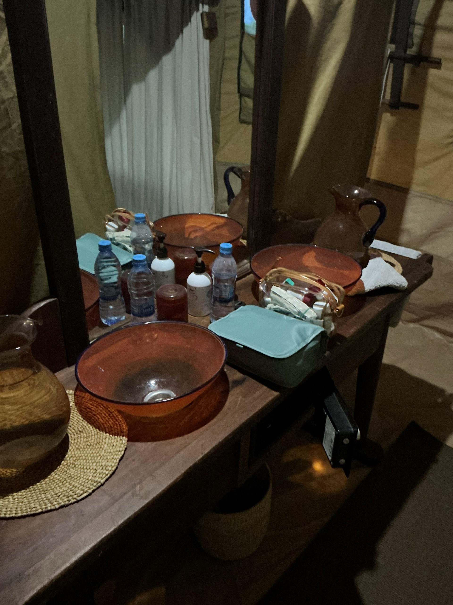 Terracotta washbasin and glass pitcher at the Nyumba camp wash station